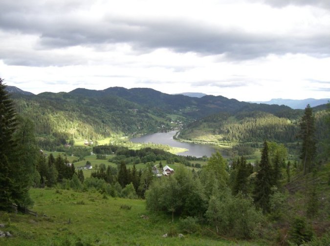 from heights above Bjaaland farm, looking southeast across Morgedal valley, with Brekke farm in the distance
